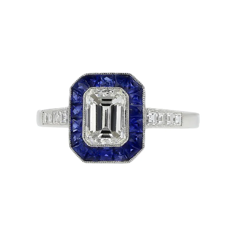 Women’s vintage-inspired engagement ring-Emerald-cut Diamond and French-cut Sapphire Halo Ring