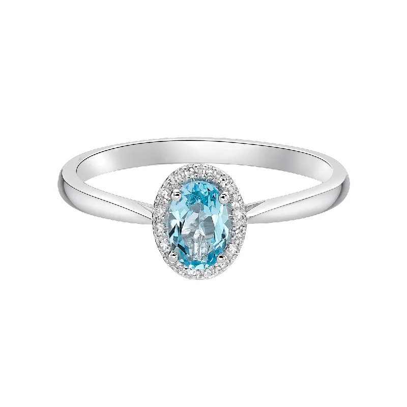 Women’s gold wedding band-10kt White Gold Oval Halo Blue Topaz Ring