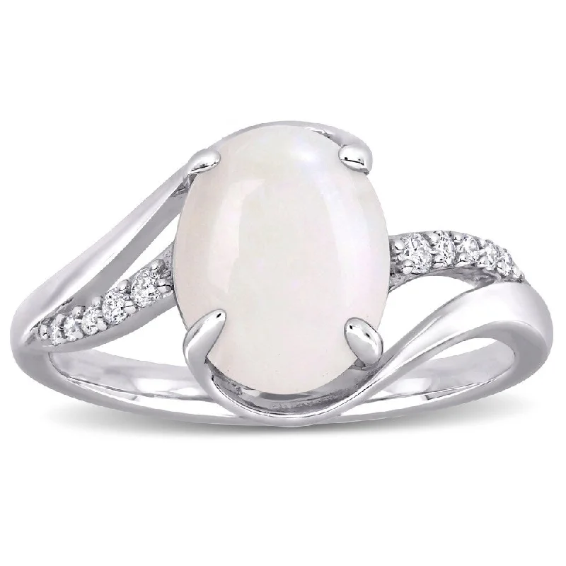 Women’s anniversary ring-Miadora Sterling Silver Oval-Cut Opal and 1/10ct TDW Diamond Bypass Ring