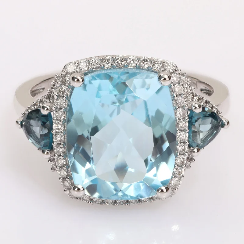 Women’s adjustable silver ring-Miadora London & Sky Blue Topaz and 1/3ct TDW Diamond 3-Stone Halo Cocktail Ring in 14k White Gold