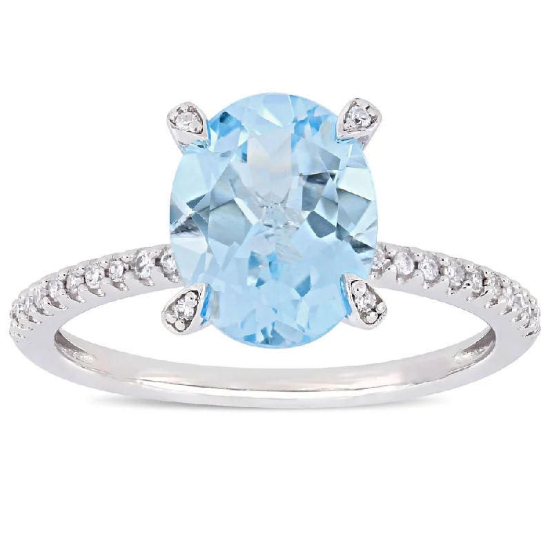 Women’s ring with diamonds-Miadora 10k White Gold Oval-Cut Sky-Blue Topaz and 1/10ct TDW Diamond Solitaire Ring